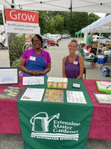 Master Gardener volunteers offer free seed packets at the traveling seed bank at the Mount Holly Farmers Market.