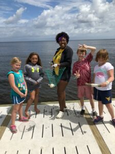 kids crabbing on eastern center's dock